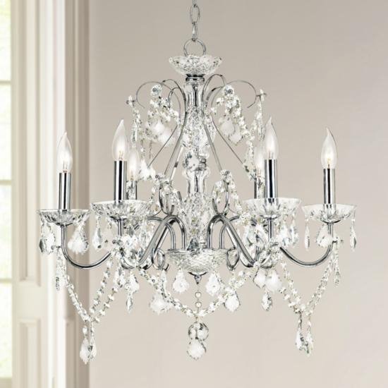 A crystal chandelier hangs in a room.