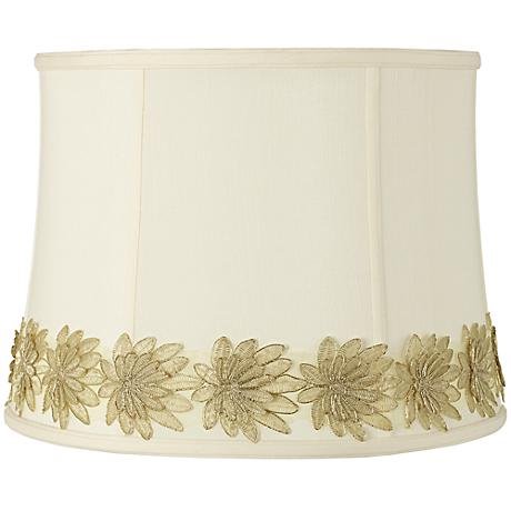 A lampshade with a custom flower trim.