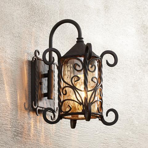 Spanish Style Dark Walnut Outdoor Wall Light A wrought iron Spanish style outdoor light at Lamps Plus.