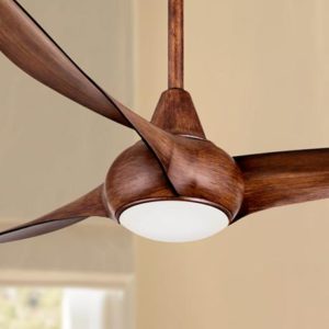 A wood finish ceiling fan. A ceiling fan with wood blades and a light kit.