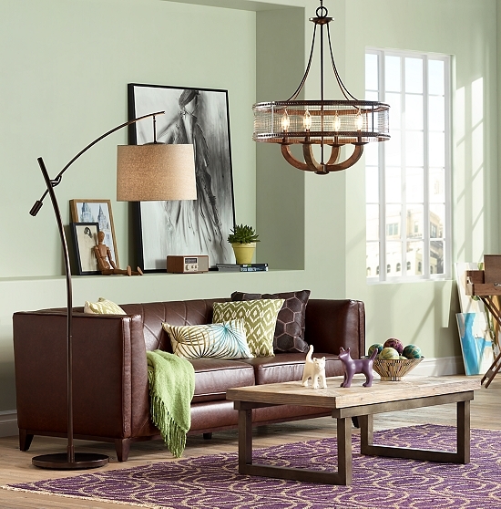 An iron chandelier over a living room.