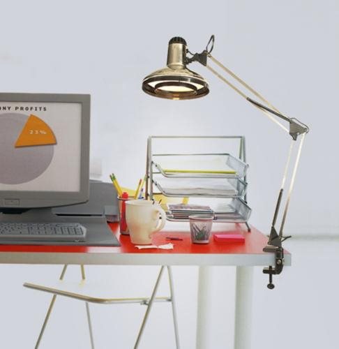 Shows how an adjustable desk lamp lights up a home office space.