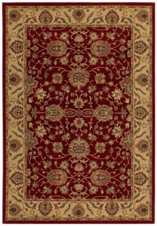 A deep red rug with golden decorative elements.