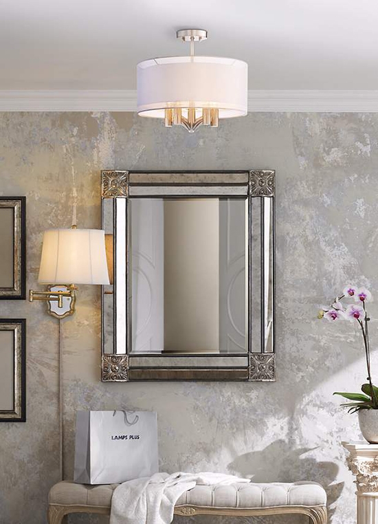 A semi-flush ceiling light installed over a home entryway. A semi-flush ceiling light over an entryway.