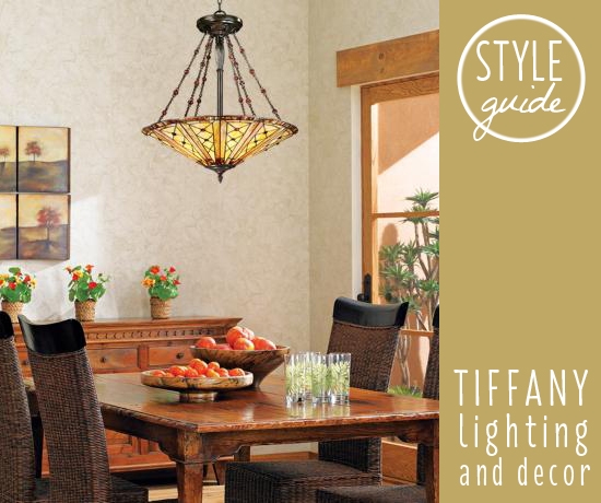 A Tiffany style chandelier hangs above a dining room table.