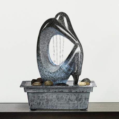 An abstract contemporary tabletop fountain design. An example of a contemporary tabletop fountain.