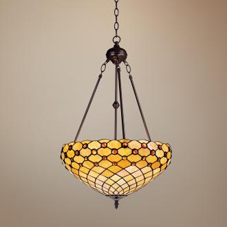 A hanging pendant light featuring Tiffany glass.