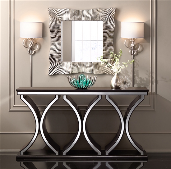 Two sconces and a square mirror in modern decor.