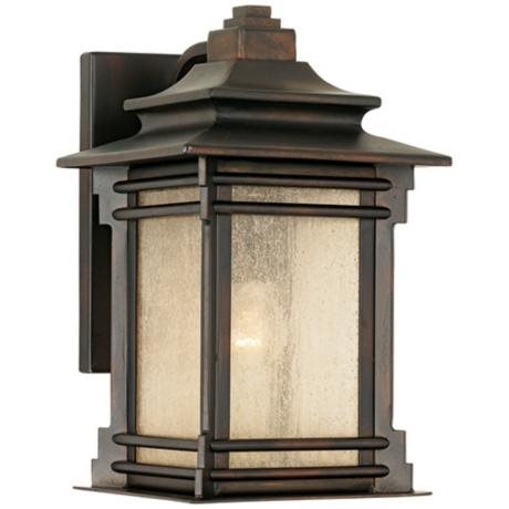 Handsome bronze finish carriage light with frosted glass panels, designed for outdoor use.