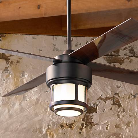 Modern-industrial ceiling fan with a light kit and four dark wood blades.