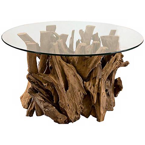 Driftwood glass top cocktail table. A Lamps Plus coffee table featuring a driftwood base and a glass table surface.