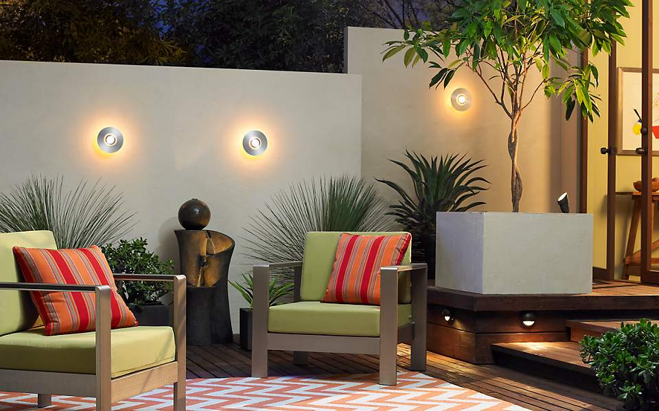 Outdoor patio set, featuring a seating area and outdoor light discs.