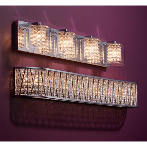 Glass-and-crystal bathroom wall lights providing a luminous glow.