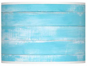 A blue and white lamp shade design that mimics wood and chipped paint. 