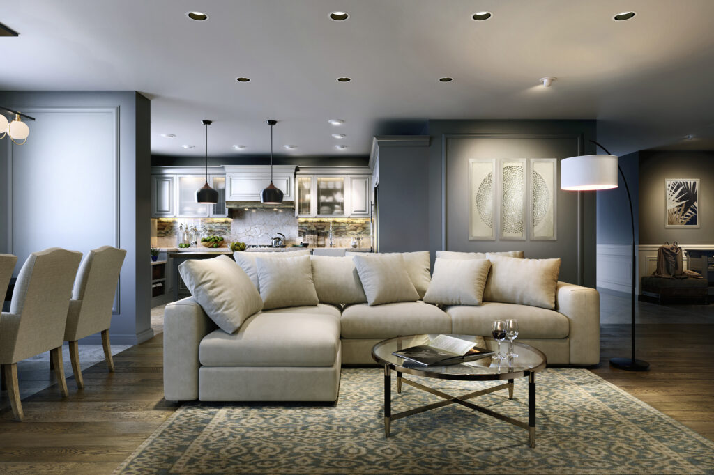 A transitional room scene featuring layers of light using pendants, recessed lights, a chandelier, and a floor lamp
