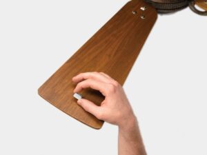 A ceiling fan blade with the permanent balance kit in place