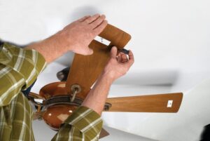 A ceiling fan with the temporary attachment