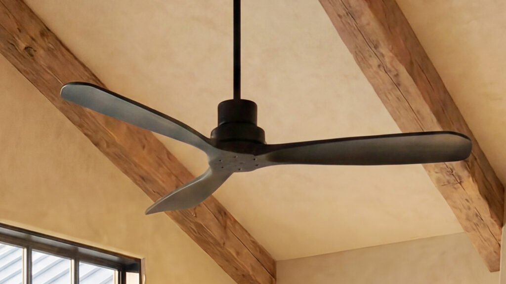 A wood finish ceiling fan in a rustic modern style